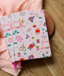 Notebook covered in fabric with sewing pattern