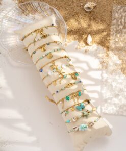 Set of 12 assorted bracelets with nautical charms, turquoise shell